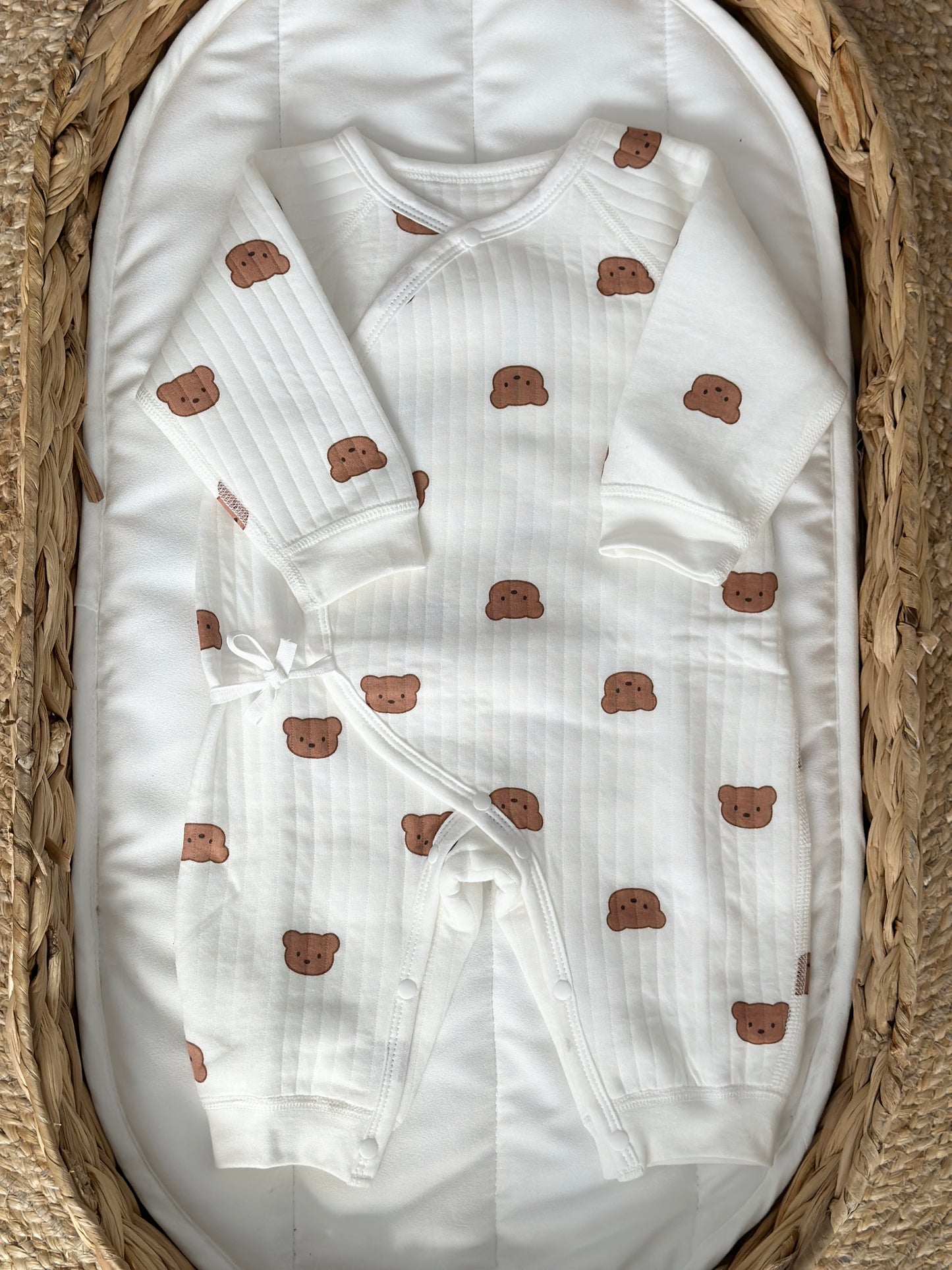 Baby romper with soft bouclé fabric and a playful bear print, designed for comfort and style