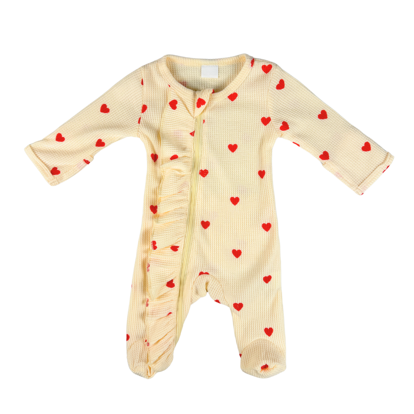 Baby girl romper in cream with love heart details and a cozy, comfortable design.
